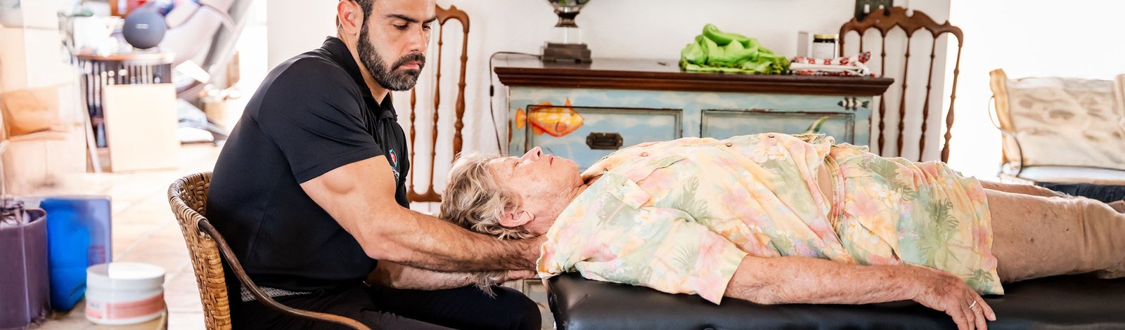 A Stellar physical therapist working with an older adult at home